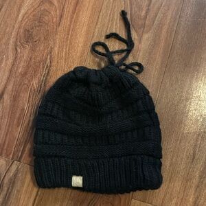 Black stocking cap for pony tail